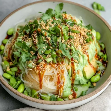 Delicious cold sesame miso noodles topped with vegetables and sesame seeds.