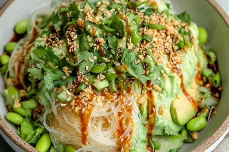 Delicious cold sesame miso noodles topped with vegetables and sesame seeds.