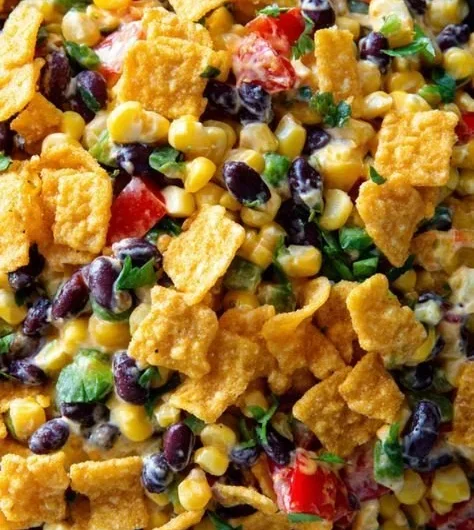Delicious creamy Frito corn salad served in a bowl.