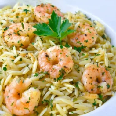 Plate of easy and delicious shrimp scampi orzo garnished with parsley