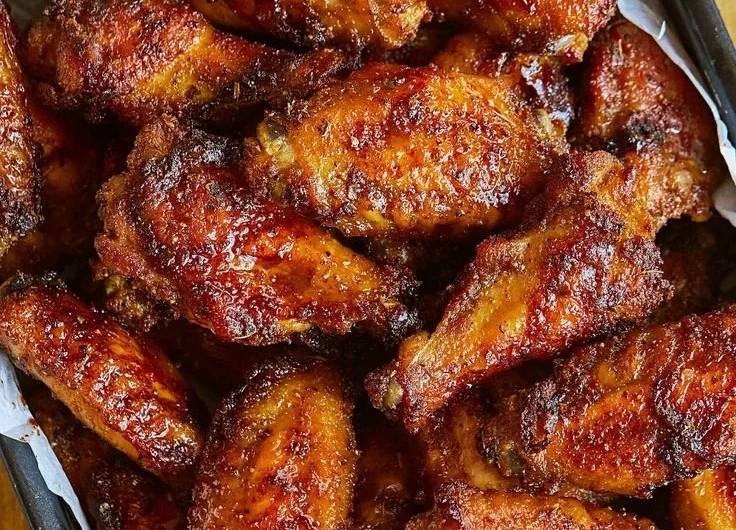 Deliciously juicy chicken wings served with a side of dipping sauce