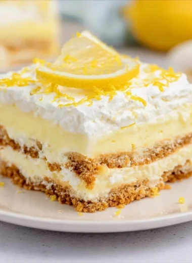 Refreshing no-bake lemon icebox cake garnished with lemon slices and mint