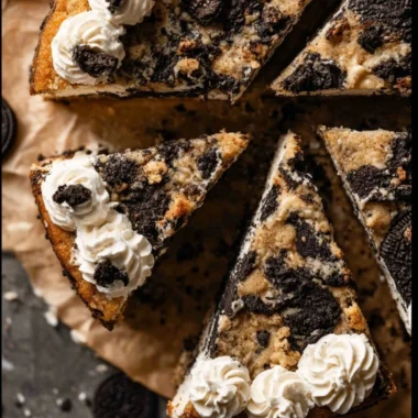 Delicious Oreo Cookie Cake topped with cream and crushed Oreos