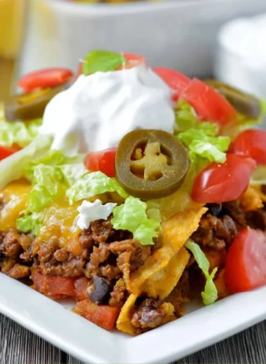 Delicious Walking Taco Casserole served in a bowl with toppings