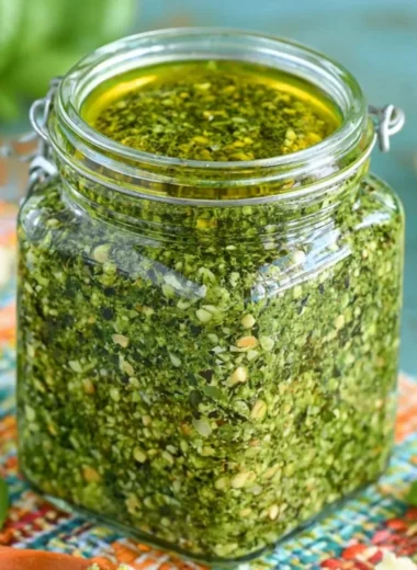Delicious homemade basil pesto sauce made with fresh basil leaves and garlic.