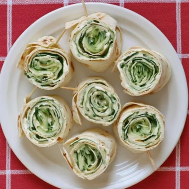Delicious cucumber wrap sandwiches elegantly arranged on a plate.