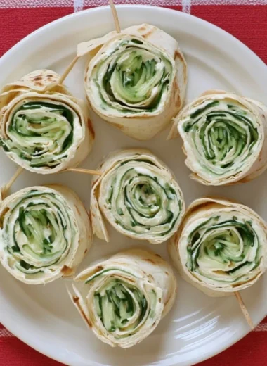 Delicious cucumber wrap sandwiches elegantly arranged on a plate.