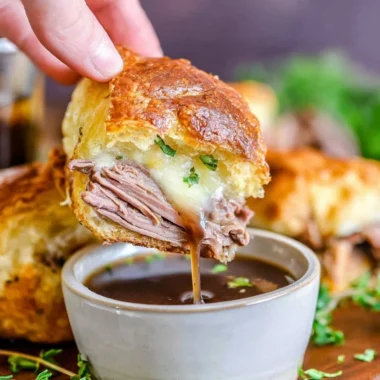 Delicious French Dip Sliders served with savory dipping sauce