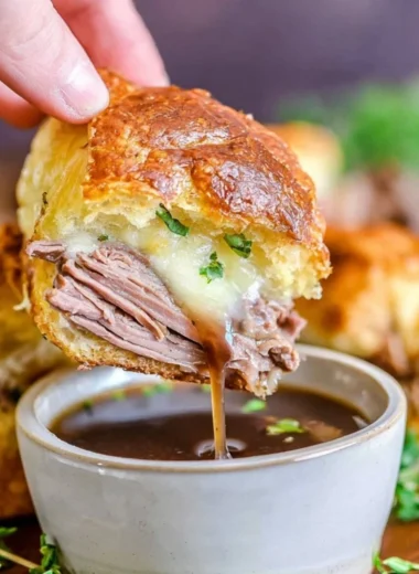 Delicious French Dip Sliders served with savory dipping sauce