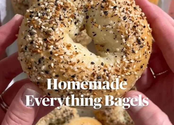 Homemade everything bagels fresh from the oven, topped with seeds and spices.