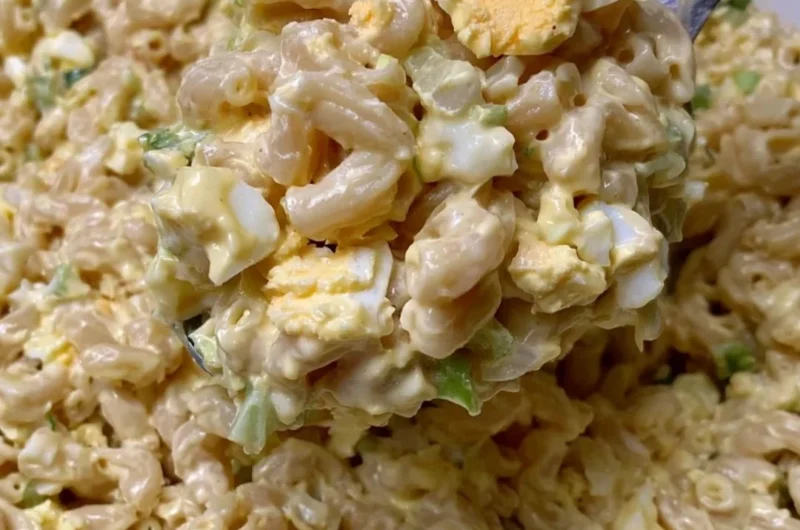 Bowl of Mom's creamy macaroni salad with vegetables and dressing