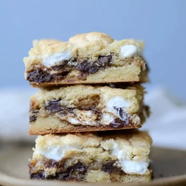 Homemade Mud Hen Bars topped with chocolate and marshmallow layers