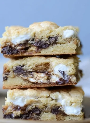 Homemade Mud Hen Bars topped with chocolate and marshmallow layers