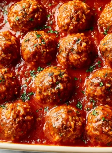Delicious porcupine meatballs served with sauce and garnished