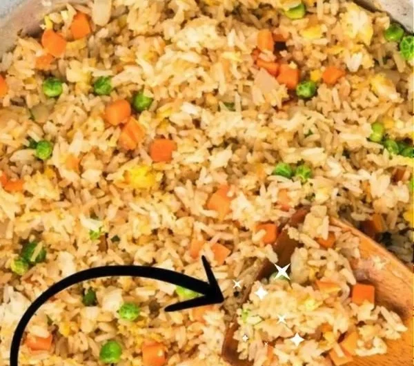 Bowl of quick and easy homemade fried rice with vegetables and eggs