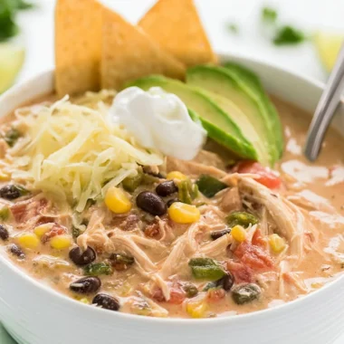 Creamy shredded chicken in a slow cooker with Tex Mex spices