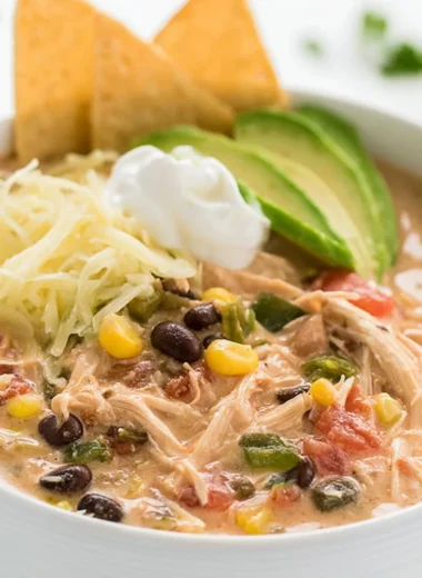 Creamy shredded chicken in a slow cooker with Tex Mex spices
