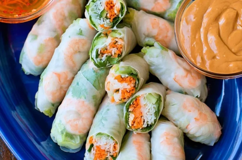 Plate of fresh Vietnamese spring rolls with dipping sauce