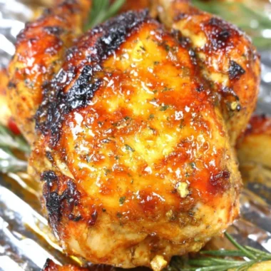 Delicious Whiskey Pineapple Chicken served on a plate with garnishes.