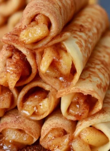 Delicious Apple Cinnamon Crepes filled with sweet apple filling and sprinkled with cinnamon