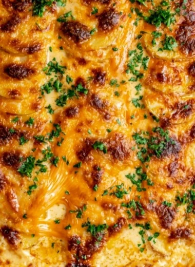 Delicious Au Gratin Potatoes baked to perfection with cheese and cream