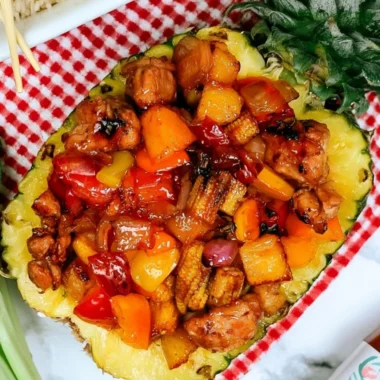 Sizzling Blackstone Pineapple Chicken served with vibrant vegetables.