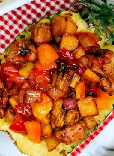 Sizzling Blackstone Pineapple Chicken served with vibrant vegetables.