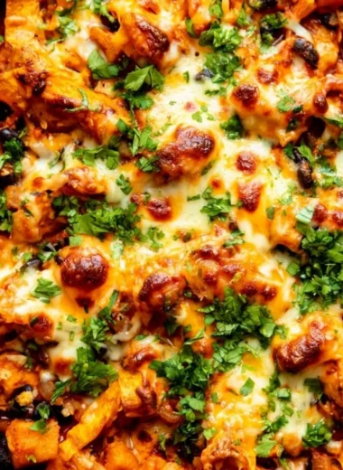 Delicious butternut squash enchiladas skillet with black beans and toppings