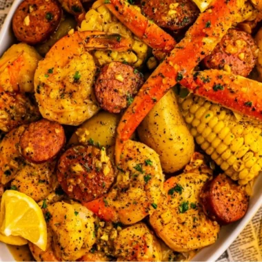 Delicious Cajun seafood boil with shrimp, crab, and spices in a vibrant pot.