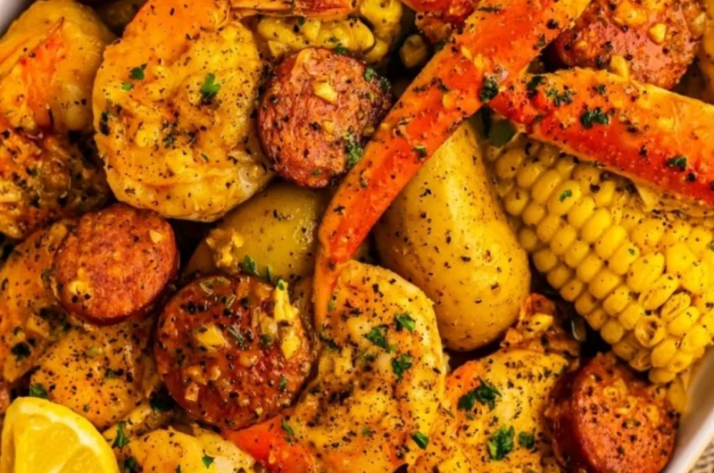 Delicious Cajun seafood boil with shrimp, crab, and spices in a vibrant pot.