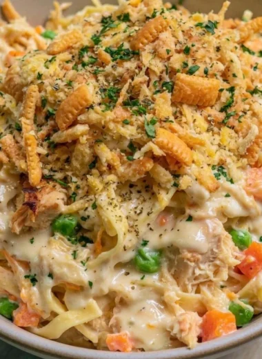 Chicken Noodle Casserole topped with cheese and baked to perfection
