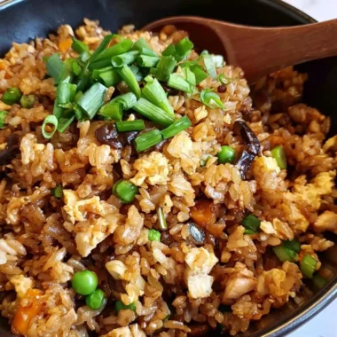 Delicious plate of Chinese Egg Fried Rice garnished with vegetables