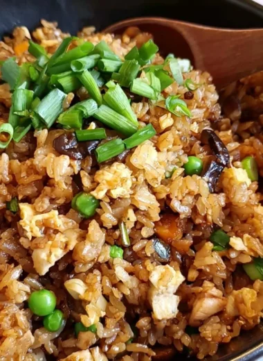 Delicious plate of Chinese Egg Fried Rice garnished with vegetables