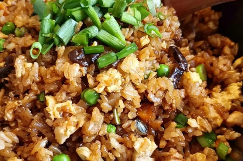 Delicious plate of Chinese Egg Fried Rice garnished with vegetables