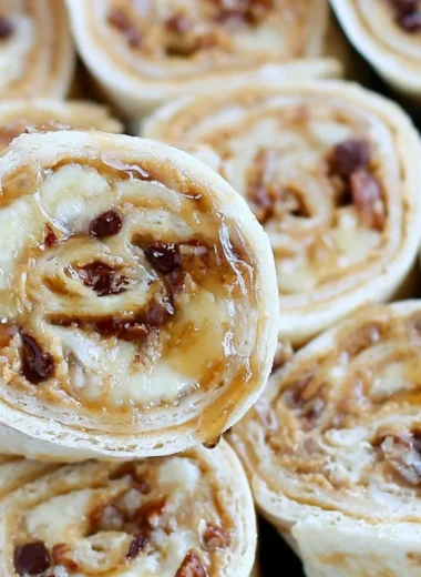 Chocolate Chip Peanut Butter Banana Roll Ups served on a plate