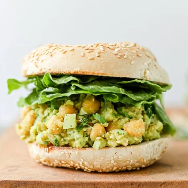 Delicious easy vegan chickpea sandwich served on whole grain bread with fresh veggies.