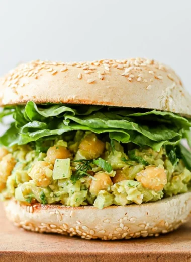 Delicious easy vegan chickpea sandwich served on whole grain bread with fresh veggies.