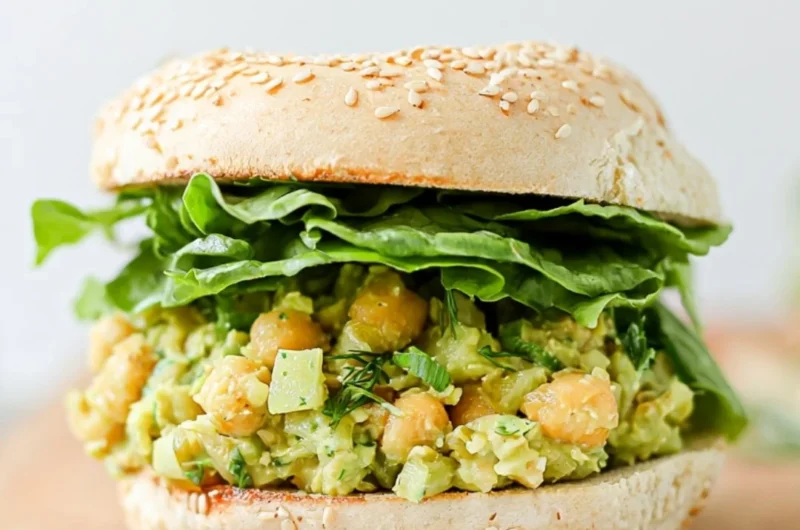 Delicious easy vegan chickpea sandwich served on whole grain bread with fresh veggies.