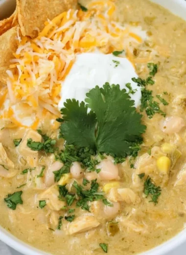 Bowls of Green Chile Chicken Enchilada Soup topped with cilantro and cheese