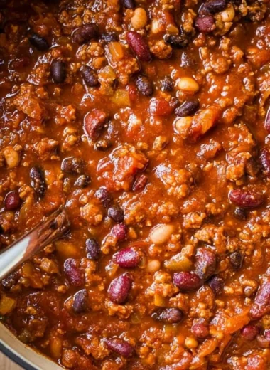Bowl of flavorful ground turkey chili topped with fresh herbs and peppers
