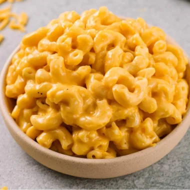 Bowl of creamy homemade mac and cheese topped with breadcrumbs.