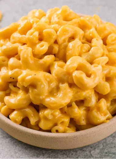 Bowl of creamy homemade mac and cheese topped with breadcrumbs.