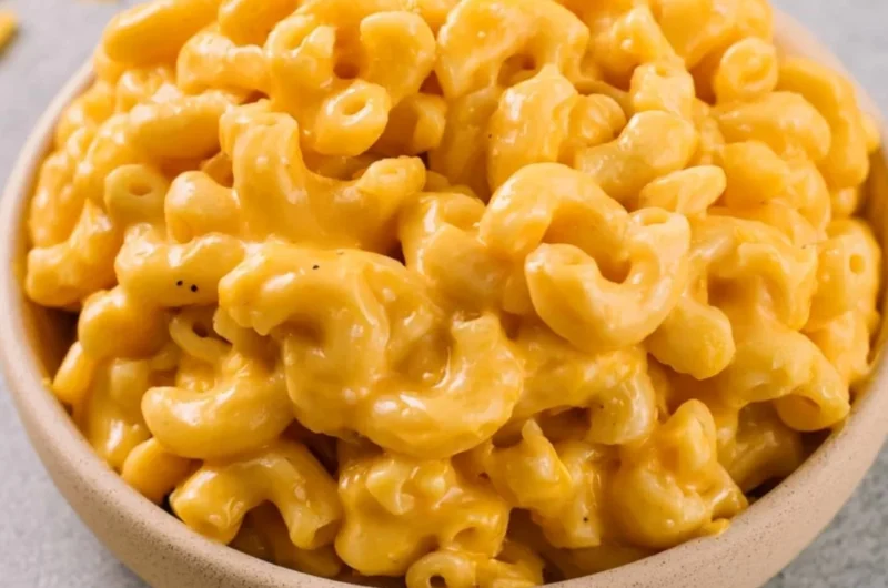 Bowl of creamy homemade mac and cheese topped with breadcrumbs.