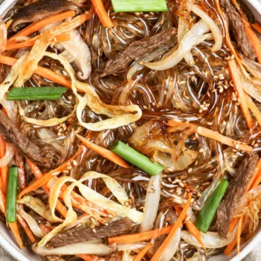 Plate of authentic Japchae, a Korean stir-fried noodle dish with vegetables.