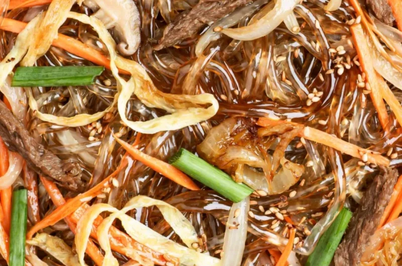 Plate of authentic Japchae, a Korean stir-fried noodle dish with vegetables.