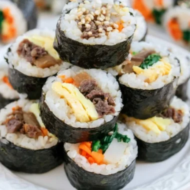 Colorful Kimbap rolls filled with rice, vegetables, and proteins wrapped in seaweed