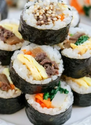 Colorful Kimbap rolls filled with rice, vegetables, and proteins wrapped in seaweed