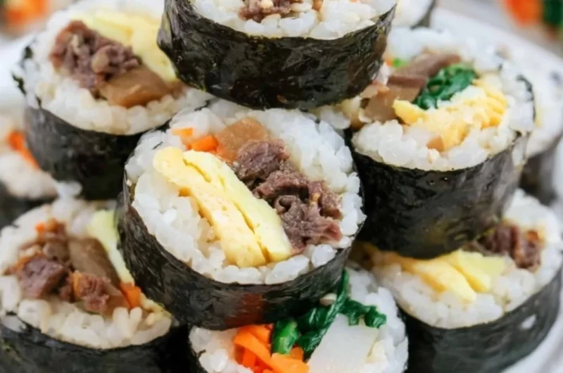 Colorful Kimbap rolls filled with rice, vegetables, and proteins wrapped in seaweed