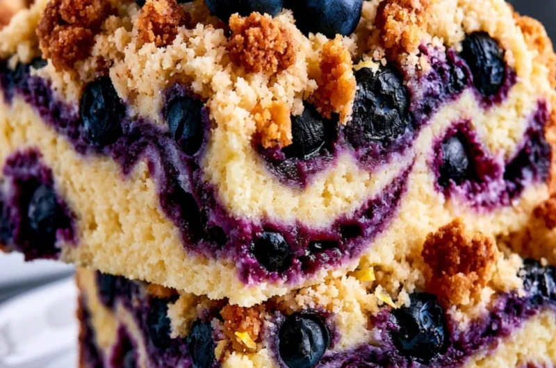 Delicious Lemon Blueberry Cake topped with fresh blueberries and zest