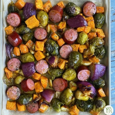 Maple Dijon Sausage with colorful roasted veggies on a sheet pan